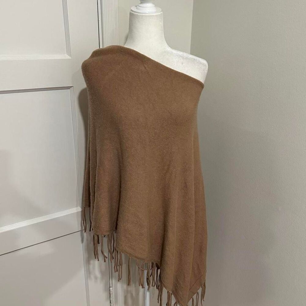 Asymmetrical poncho with fringe tassels